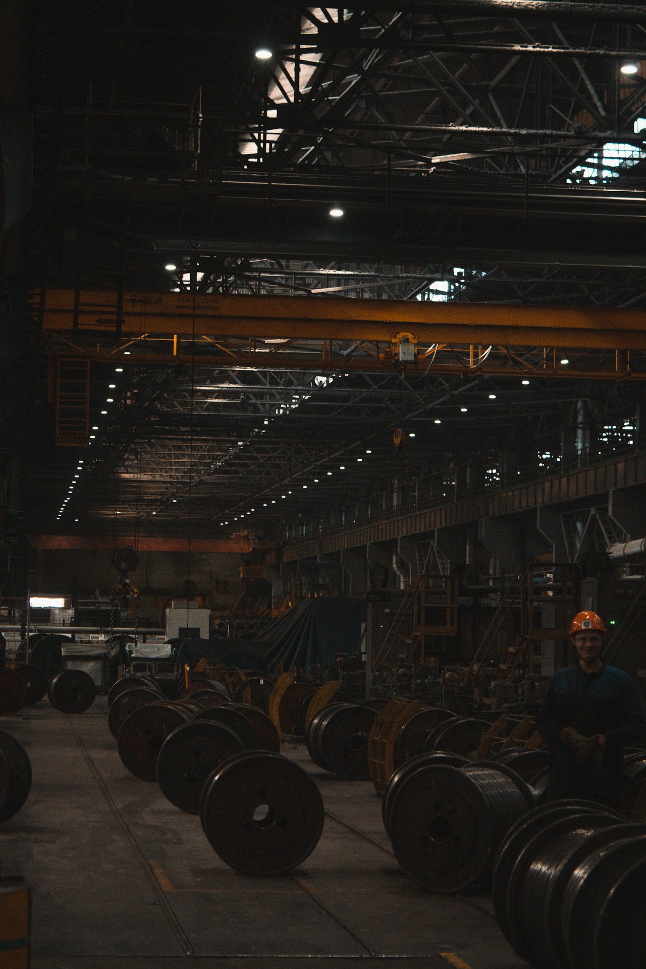 Industrial warehouse with steel stock and equipment requiring corrosion protection